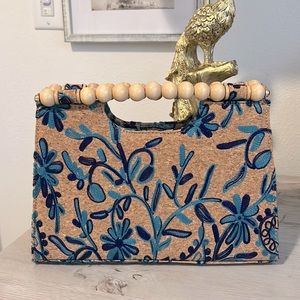 Blue floral embroidered clutch with wooden beaded handle